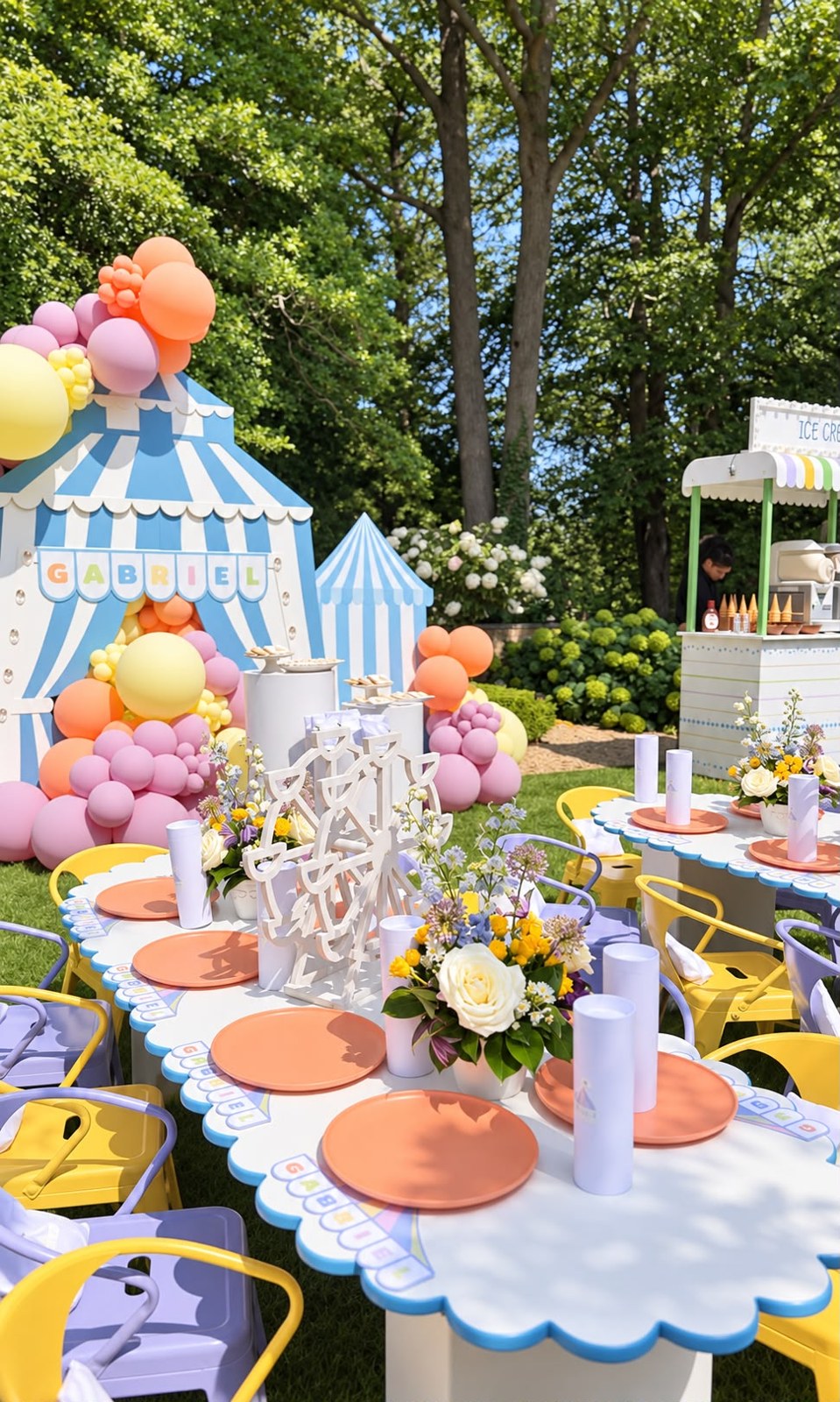 Carnival-themed children's party tables with scalloped edges, place settings and a striped tent backdrop