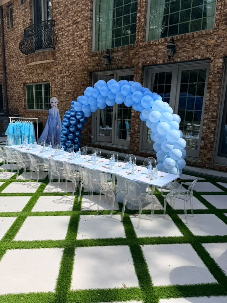 Kids' party table set with elegant ice-blue styling and child-sized chairs