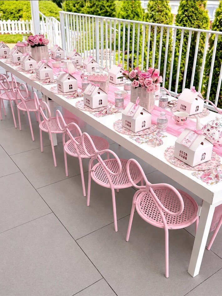 Pink children's chairs and white rental table at a floral tea party designed by Decor Party Dream